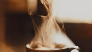 brown ceramic cup with white smoke